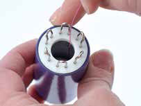 Wire being inserted into knitter